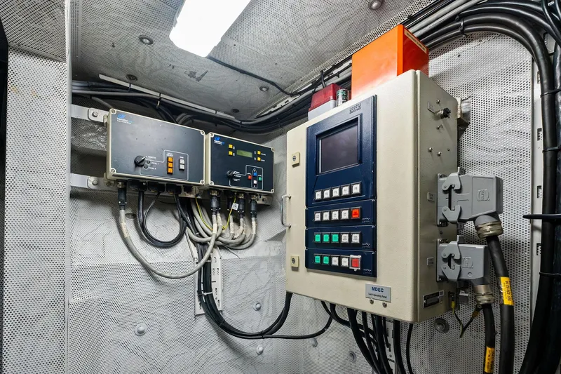 Pegasus Ix Yacht Photos Pics Electrical control panel in a Sabre 92, 2004 model, with various switches and cables.