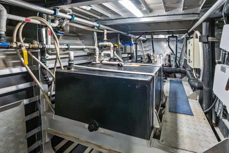 Pegasus Ix Yacht Photos Pics Engine room of a 2004 Sabre 92 yacht with complex piping and machinery.