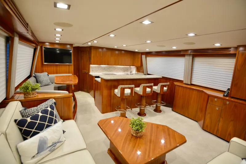 Slow Your Roll Yacht Photos Pics Luxurious interior of 2019 Viking 68 Convertible yacht with elegant wood finishes and modern amenities.