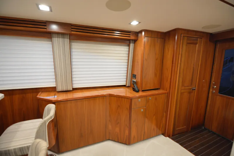 Slow Your Roll Yacht Photos Pics Luxurious interior of 2019 Viking 68 Convertible yacht with elegant wood finish.