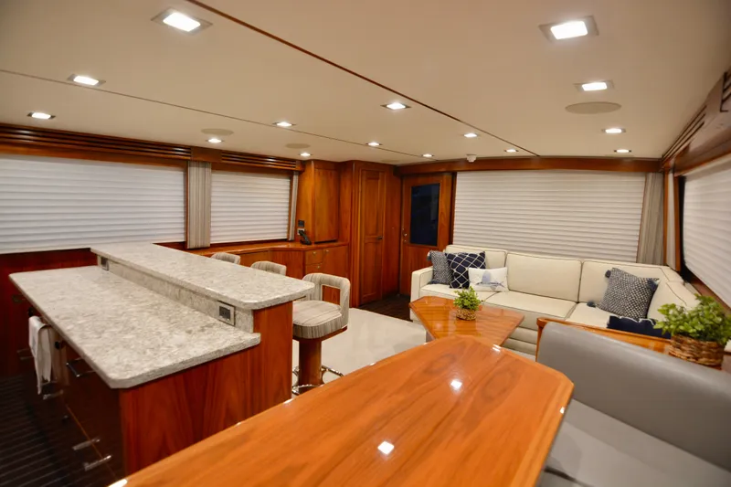 Slow Your Roll Yacht Photos Pics Luxurious interior of 2019 Viking 68 Convertible yacht with elegant seating and modern decor.