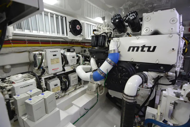 Slow Your Roll Yacht Photos Pics Engine room of 2019 Viking 68 Convertible yacht featuring MTU machinery and Dometic systems.