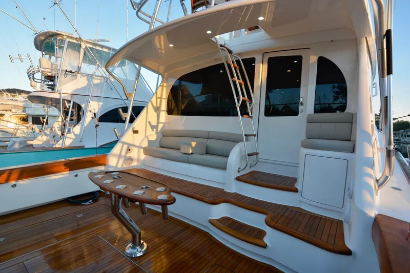 Slow Your Roll Yacht Photos Pics 2019 Viking 68 Convertible yacht with elegant teak deck and seating area.