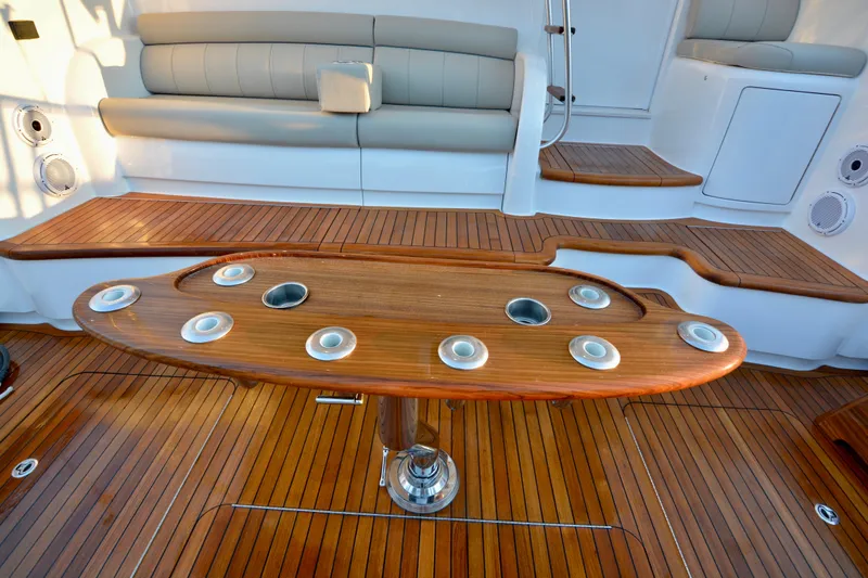 Slow Your Roll Yacht Photos Pics Luxurious 2019 Viking 68 Convertible yacht interior with elegant wood finish and seating area.