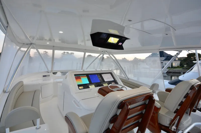 Slow Your Roll Yacht Photos Pics Luxurious interior of 2019 Viking 68 Convertible yacht with advanced navigation system.