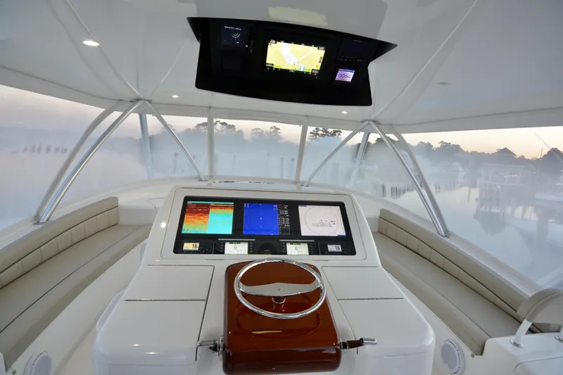 Slow Your Roll Yacht Photos Pics Cockpit of 2019 Viking 68 Convertible yacht with advanced navigation displays.