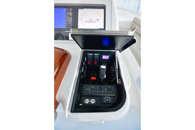 Slow Your Roll Yacht Photos Pics Control panel of 2019 Viking 68 Convertible yacht with navigation and communication equipment.