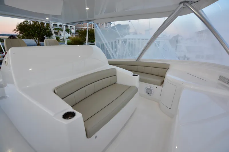 Slow Your Roll Yacht Photos Pics Luxurious seating area on a 2019 Viking 68 Convertible yacht, featuring sleek design and comfort.