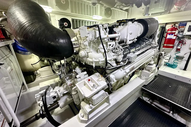 Slow Your Roll Yacht Photos Pics Engine room of 2019 Viking 68 Convertible yacht, showcasing powerful machinery and equipment.