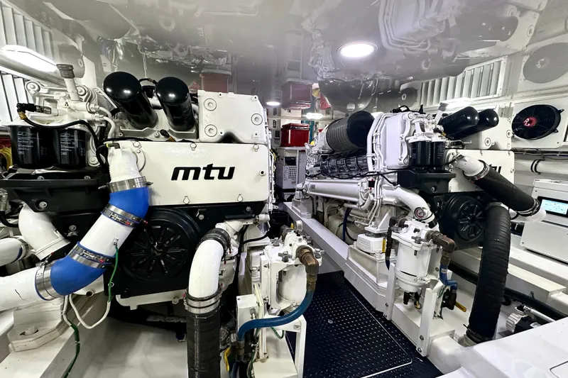 Slow Your Roll Yacht Photos Pics Engine room of 2019 Viking 68 Convertible yacht featuring MTU engines.