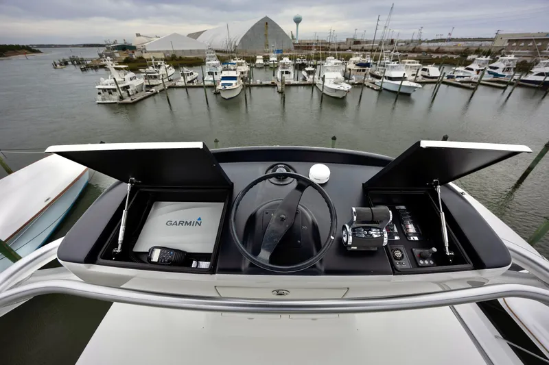Slow Your Roll Yacht Photos Pics Cockpit view of 2019 Viking 68 Convertible yacht with Garmin navigation system.