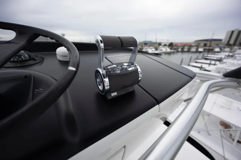 Slow Your Roll Yacht Photos Pics Control panel of 2019 Viking 68 Convertible yacht overlooking marina.