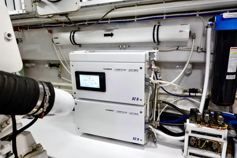 Slow Your Roll Yacht Photos Pics Engine room of 2019 Viking 68 Convertible yacht with advanced water filtration system.