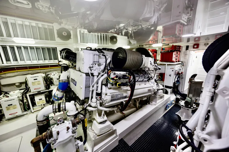 Slow Your Roll Yacht Photos Pics Engine room of 2019 Viking 68 Convertible yacht, featuring MTU engines and advanced equipment.