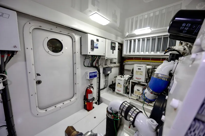 Slow Your Roll Yacht Photos Pics Engine room of 2019 Viking 68 Convertible yacht, featuring control panels and equipment.