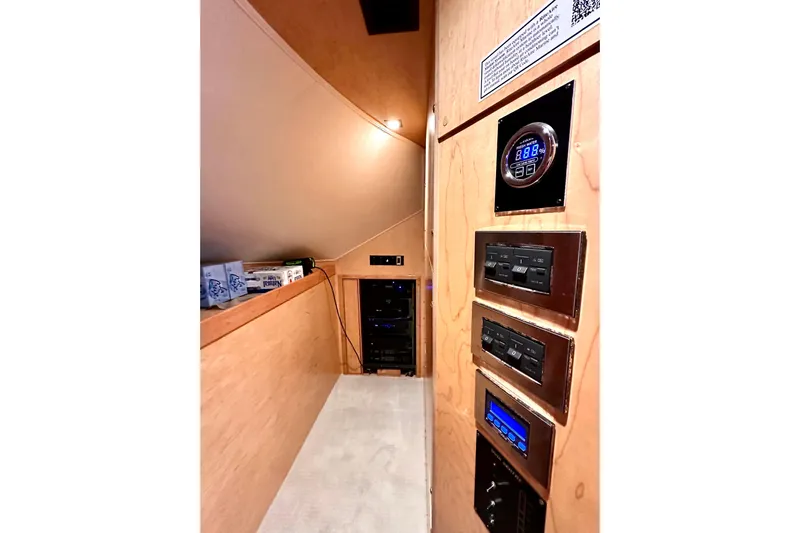 Slow Your Roll Yacht Photos Pics 2019 Viking 68 Convertible yacht interior with control panels and storage area.