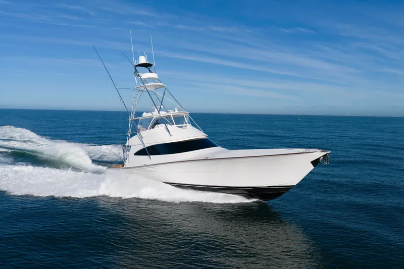 Slow Your Roll Yacht Photos Pics 2019 Viking 68 Convertible yacht cruising on open sea under clear blue sky.