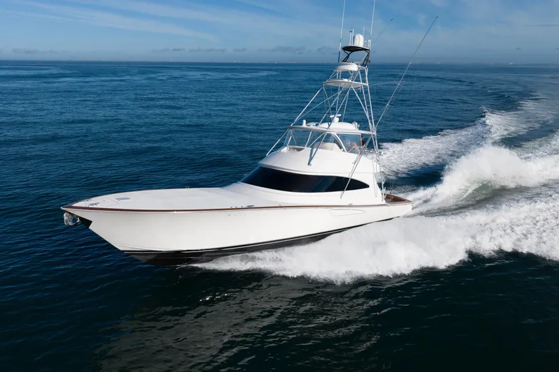 Slow Your Roll Yacht Photos Pics 2019 Viking 68 Convertible yacht cruising on open ocean waters.