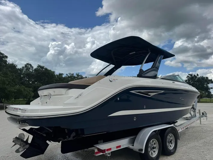  Yacht Photos Pics 2021 Sea Ray SLX 280 boat on trailer under cloudy sky.