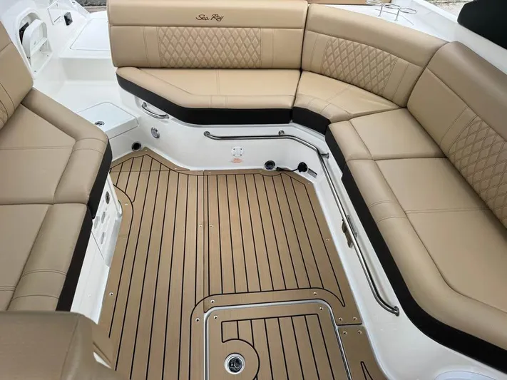  Yacht Photos Pics Luxurious seating area on a 2021 Sea Ray SLX 280 boat with tan upholstery.