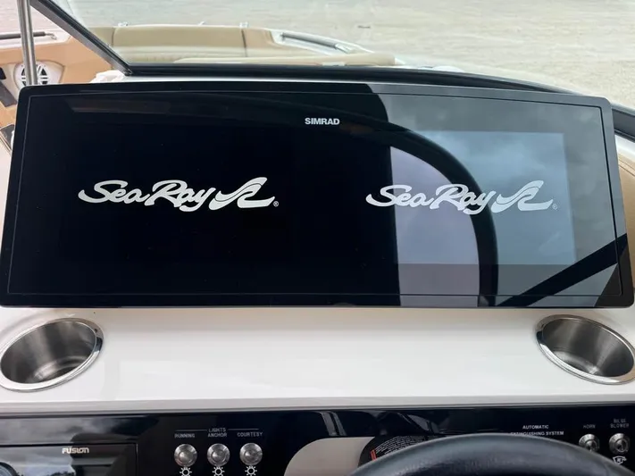  Yacht Photos Pics Dashboard of a 2021 Sea Ray SLX 280 boat with Simrad display.