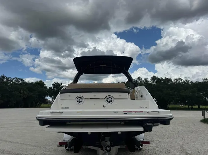  Yacht Photos Pics 2021 Sea Ray SLX 280 boat on trailer under cloudy sky.