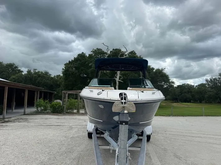  Yacht Photos Pics 2021 Sea Ray SLX 280 boat on trailer under cloudy sky.
