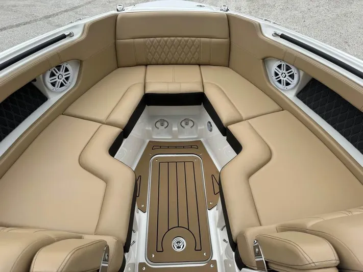  Yacht Photos Pics Luxurious interior of 2021 Sea Ray SLX 280 boat with tan seating and sleek design.