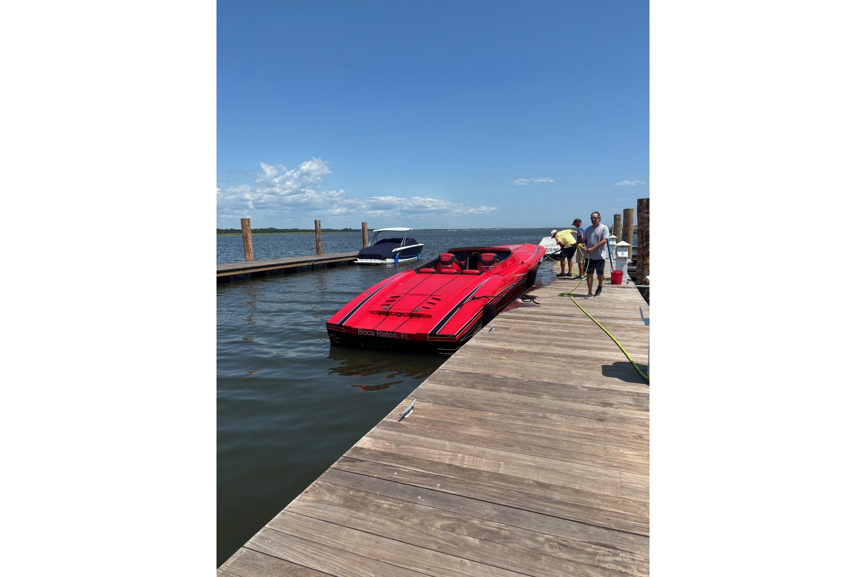 2022 Outerlimits SL41 speedboat docked on a sunny day.