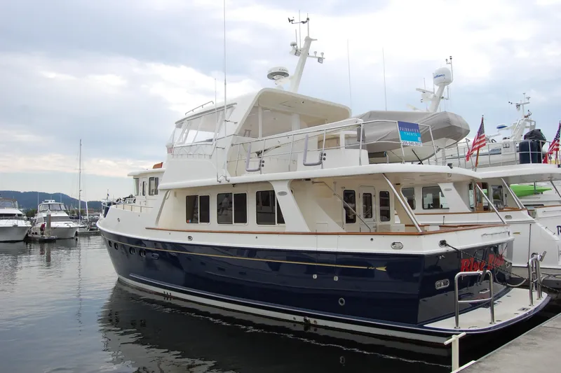 Blue Red Yacht Photos Pics 2006 Selene Pilothouse Ocean Trawler docked at marina, featuring elegant design and spacious decks.