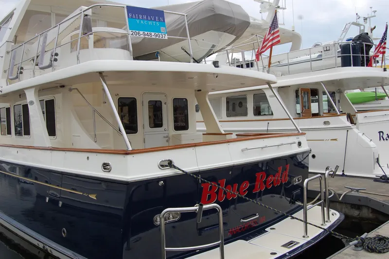Blue Red Yacht Photos Pics 2006 Selene Pilothouse Ocean Trawler docked, featuring "Blue Redd" name and Fairhaven Yachts sign.