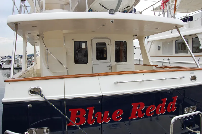 Blue Red Yacht Photos Pics 2006 Selene Pilothouse Ocean Trawler "Blue Redd" docked at marina, rear view.