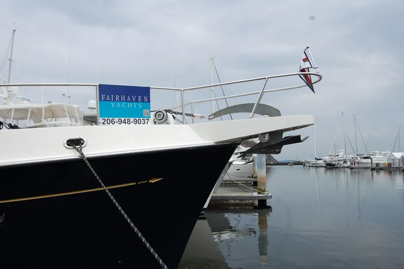 Blue Red Yacht Photos Pics 2006 Selene Pilothouse Ocean Trawler docked at marina, Fairhaven Yachts sign visible.