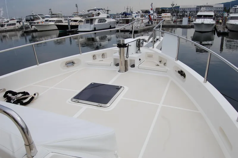 Blue Red Yacht Photos Pics 2006 Selene Pilothouse Ocean Trawler at marina, showcasing spacious deck and moored boats.