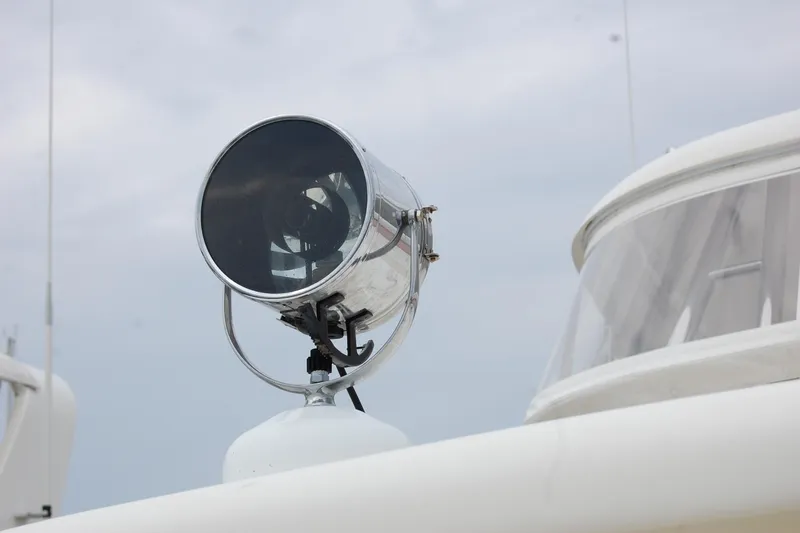 Blue Red Yacht Photos Pics Spotlight on 2006 Selene Pilothouse Ocean Trawler against cloudy sky.