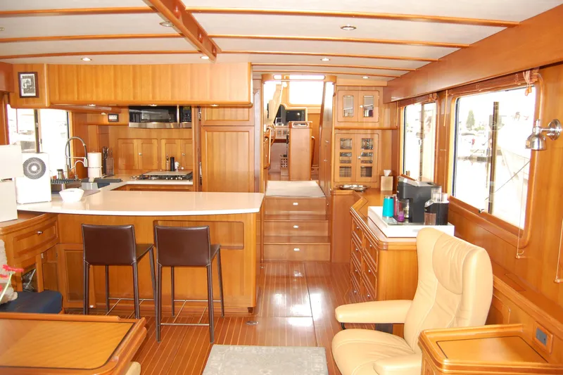Blue Red Yacht Photos Pics Luxurious interior of 2006 Selene Pilothouse Ocean Trawler with wood finishes and modern amenities.