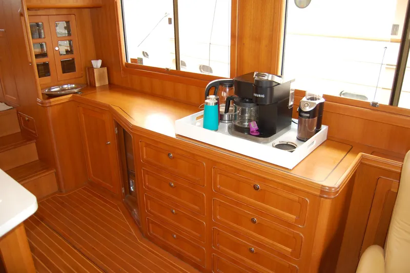 Blue Red Yacht Photos Pics 2006 Selene Pilothouse Ocean Trawler interior with wooden cabinetry and coffee maker setup.