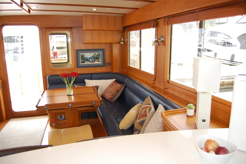 Blue Red Yacht Photos Pics Interior of 2006 Selene Pilothouse Ocean Trawler with cozy seating and elegant decor.