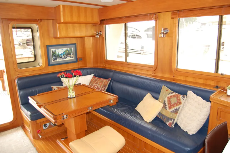 Blue Red Yacht Photos Pics Luxurious 2006 Selene Pilothouse Ocean Trawler interior with cozy seating and elegant decor.