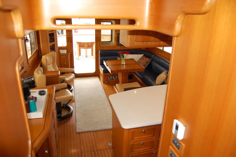 Blue Red Yacht Photos Pics Luxurious interior of 2006 Selene Pilothouse Ocean Trawler with wood finish and comfortable seating.