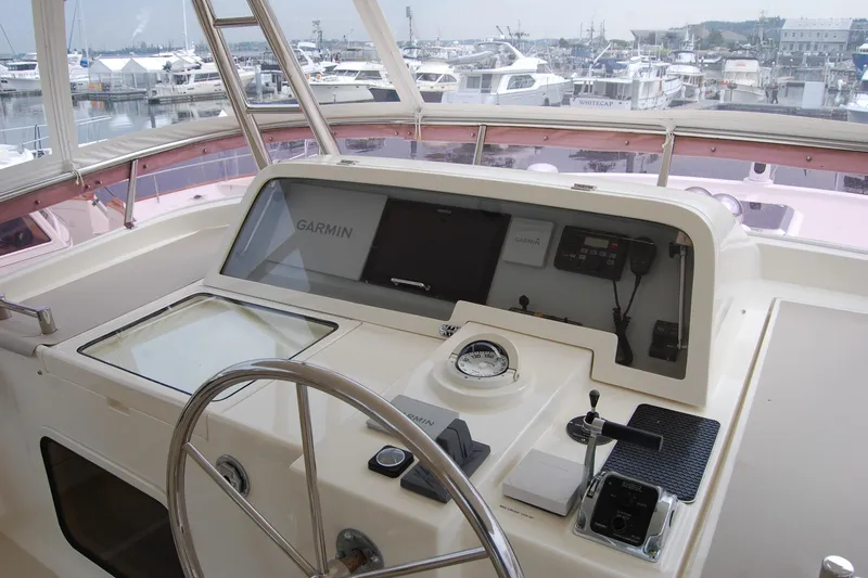 Blue Red Yacht Photos Pics Pilothouse of 2006 Selene Ocean Trawler with Garmin navigation, docked at marina.