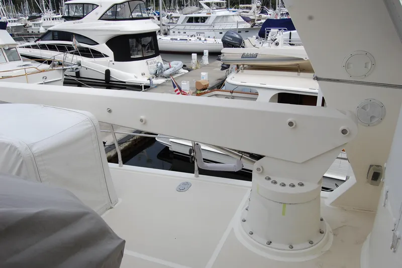 Blue Red Yacht Photos Pics 2006 Selene Pilothouse Ocean Trawler docked, featuring deck equipment and nearby boats.