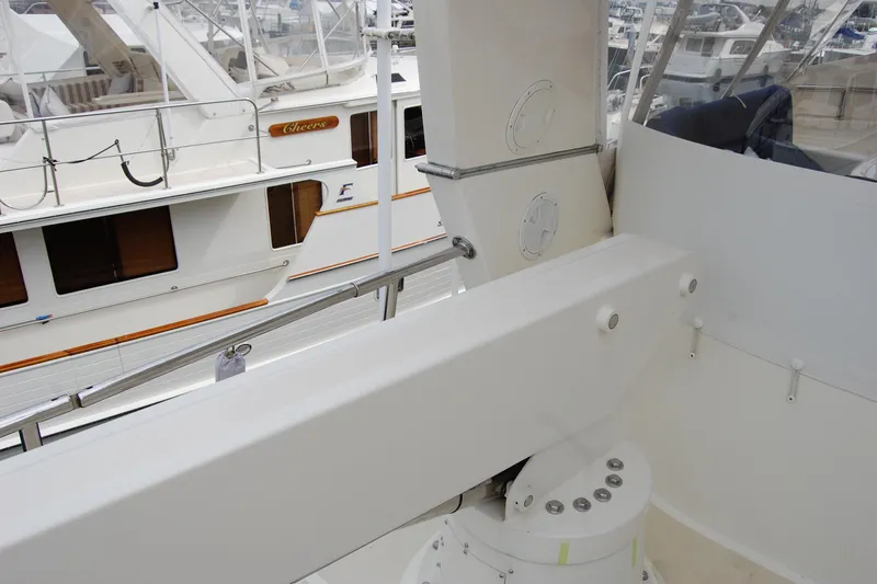 Blue Red Yacht Photos Pics 2006 Selene Pilothouse Ocean Trawler deck view with adjacent boats in marina.