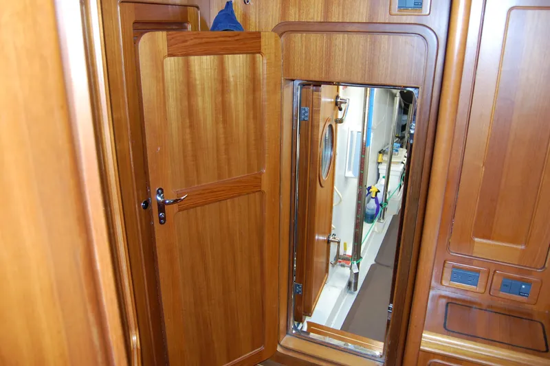Blue Red Yacht Photos Pics Interior of 2006 Selene Pilothouse Ocean Trawler with wooden doors and engine room access.