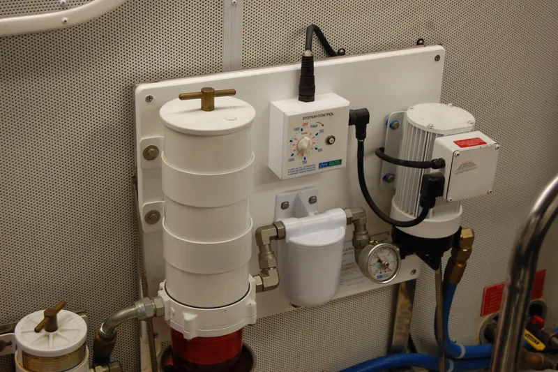 Blue Red Yacht Photos Pics Engine room equipment on a 2006 Selene Pilothouse Ocean Trawler, featuring control systems and gauges.