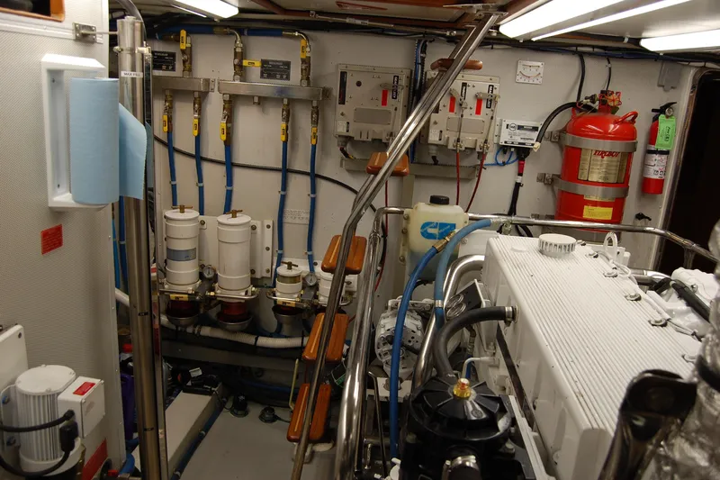 Blue Red Yacht Photos Pics Engine room of 2006 Selene Pilothouse Ocean Trawler with machinery and safety equipment.
