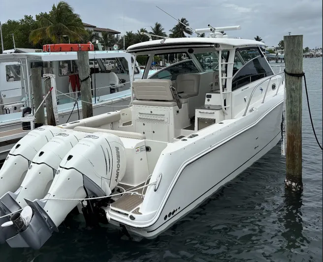  Yacht Photos Pics 2016 Boston Whaler 345 Conquest boat docked with triple Mercury engines.