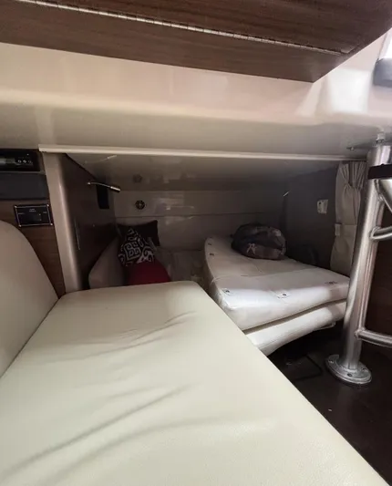  Yacht Photos Pics Interior cabin of a 2016 Boston Whaler 345 Conquest, featuring seating and bedding.