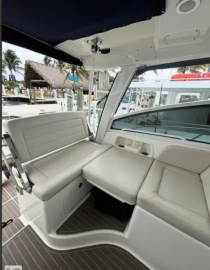  Yacht Photos Pics Interior seating of a 2016 Boston Whaler 345 Conquest boat at a marina.