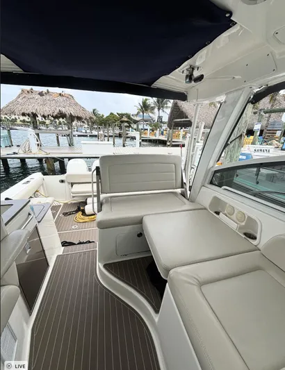  Yacht Photos Pics 2016 Boston Whaler 345 Conquest interior with seating, dock view, and tropical setting.
